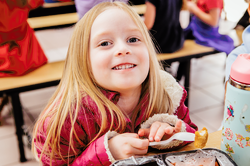 Kid smililing in charter school Axis Fort Collins